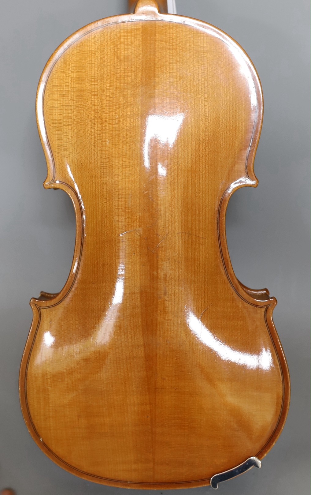 A cased 20th century Romanian violin, back measures 35.5cm excl button